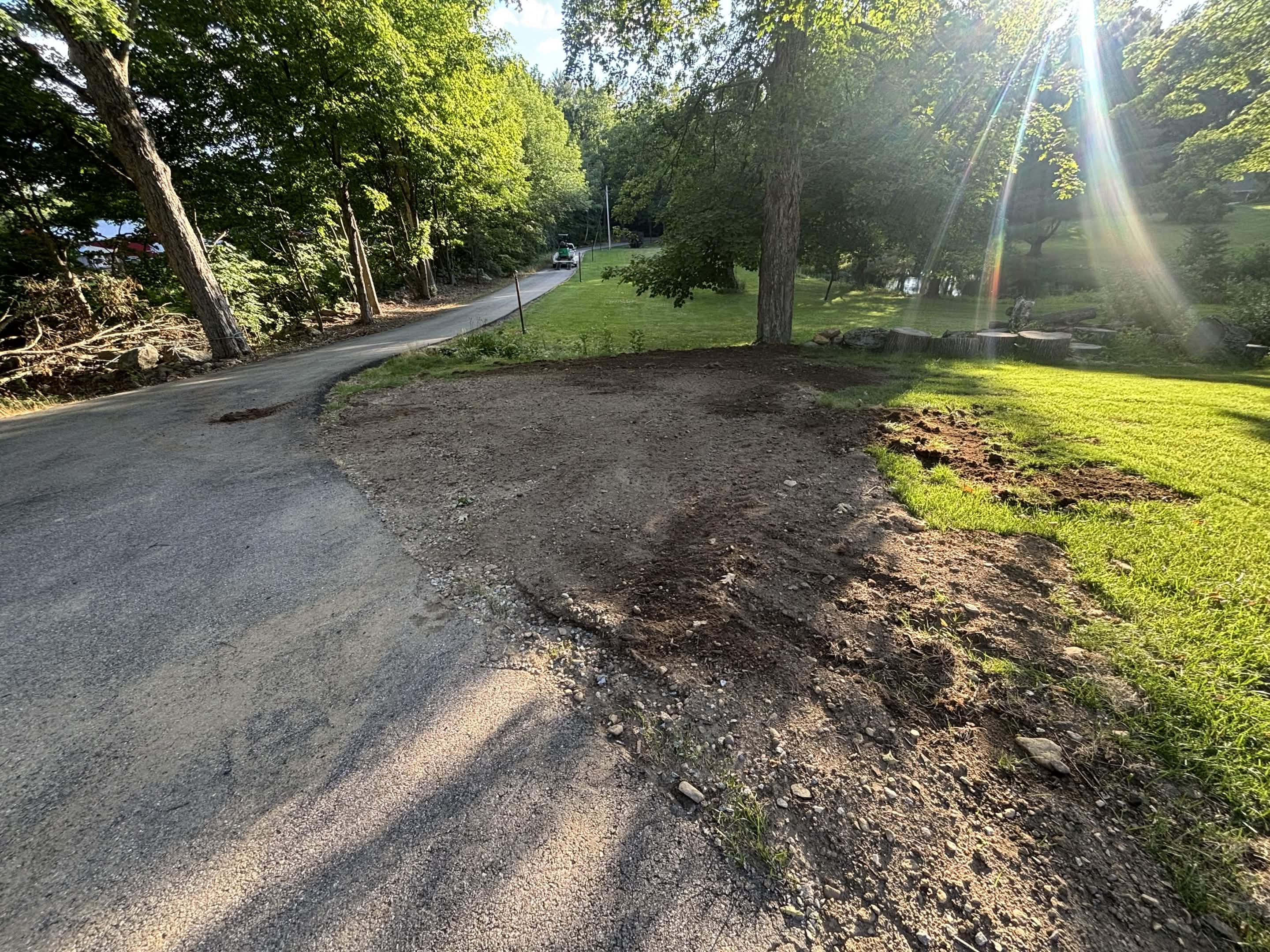 Loam spread and graded over completed drain system in Spencer, MA